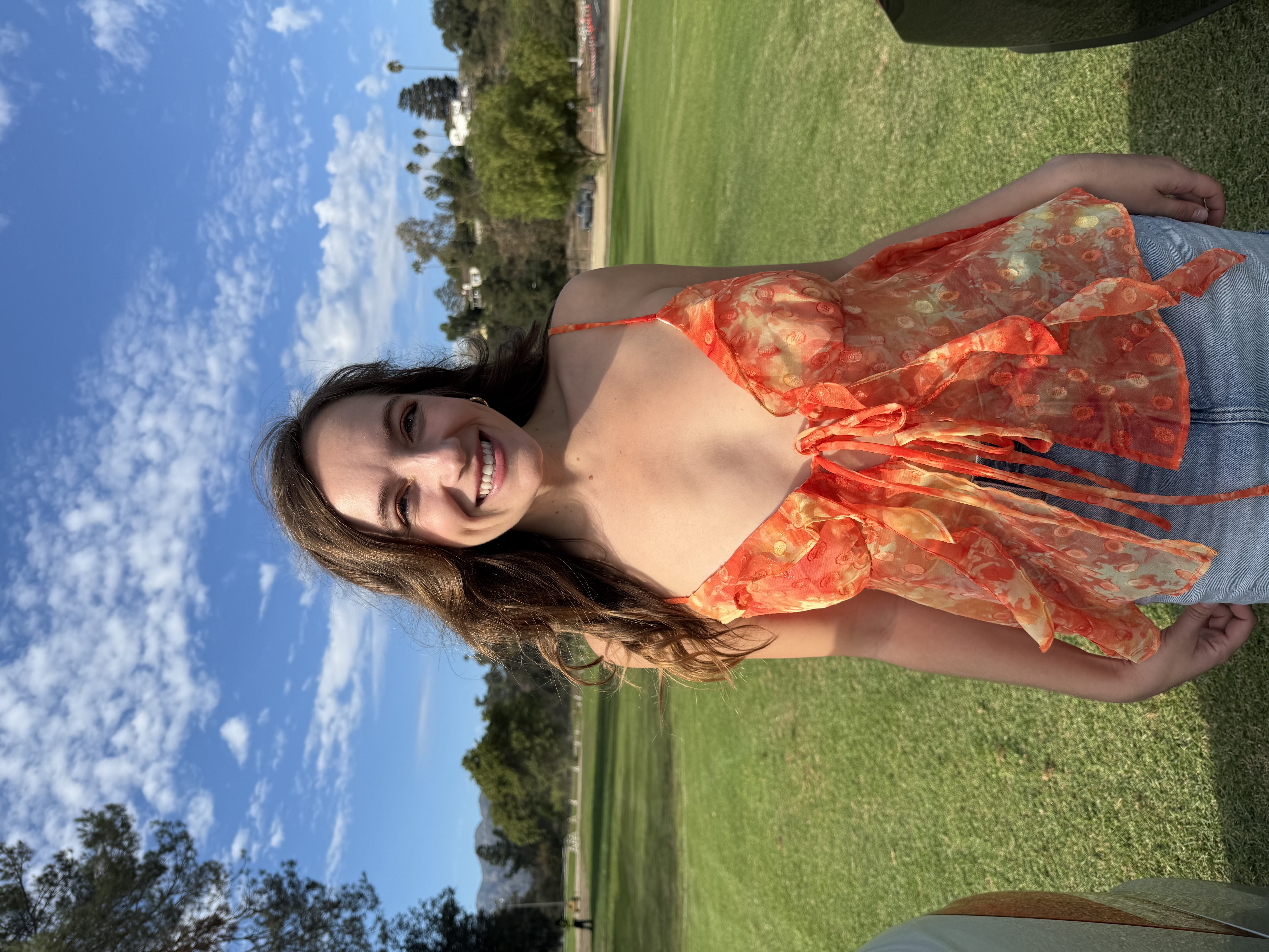 Emily wearing the finished Jaya Top in orange dot-print fabric